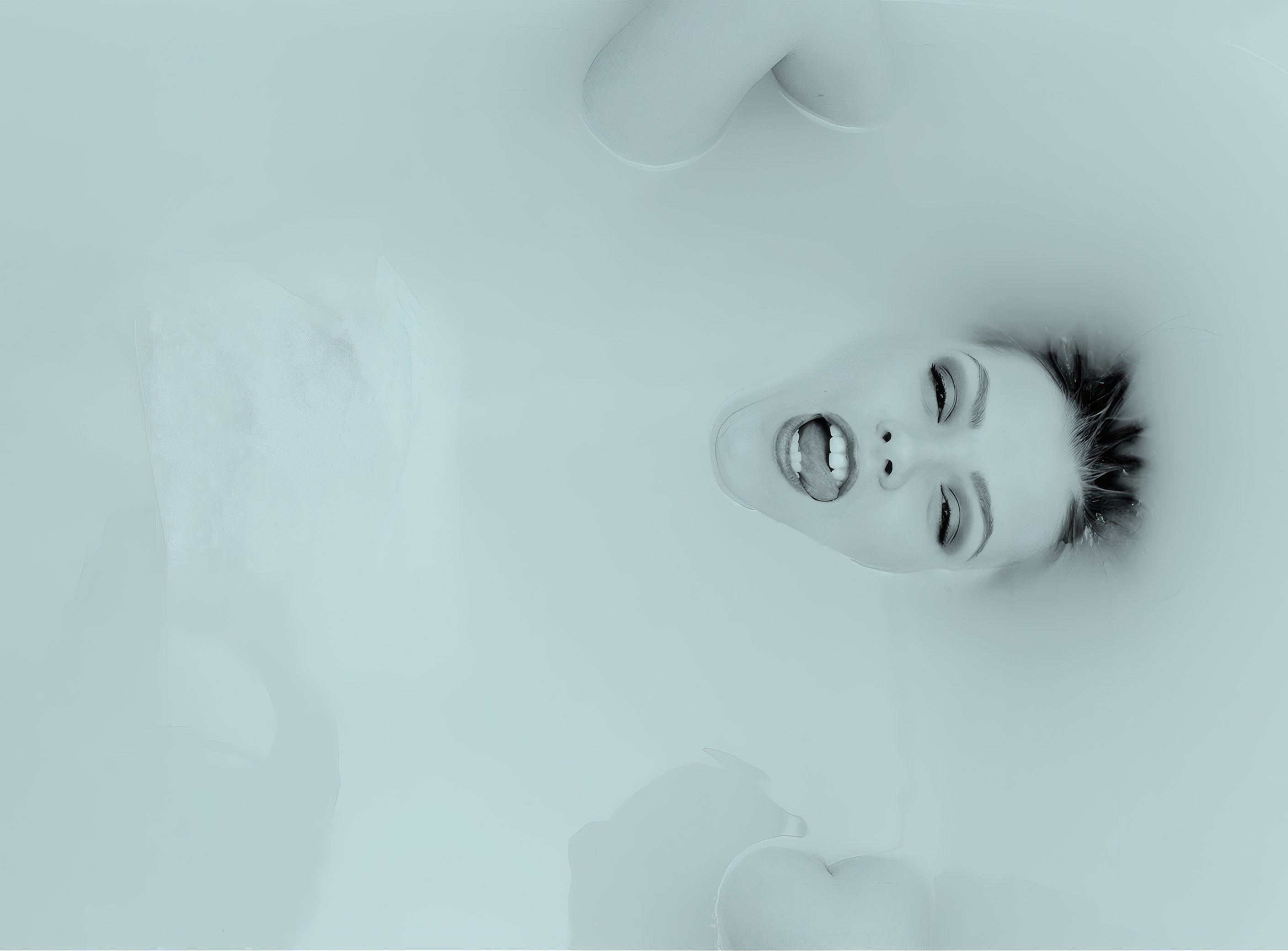 A face in pale teal milk for Verre Skin