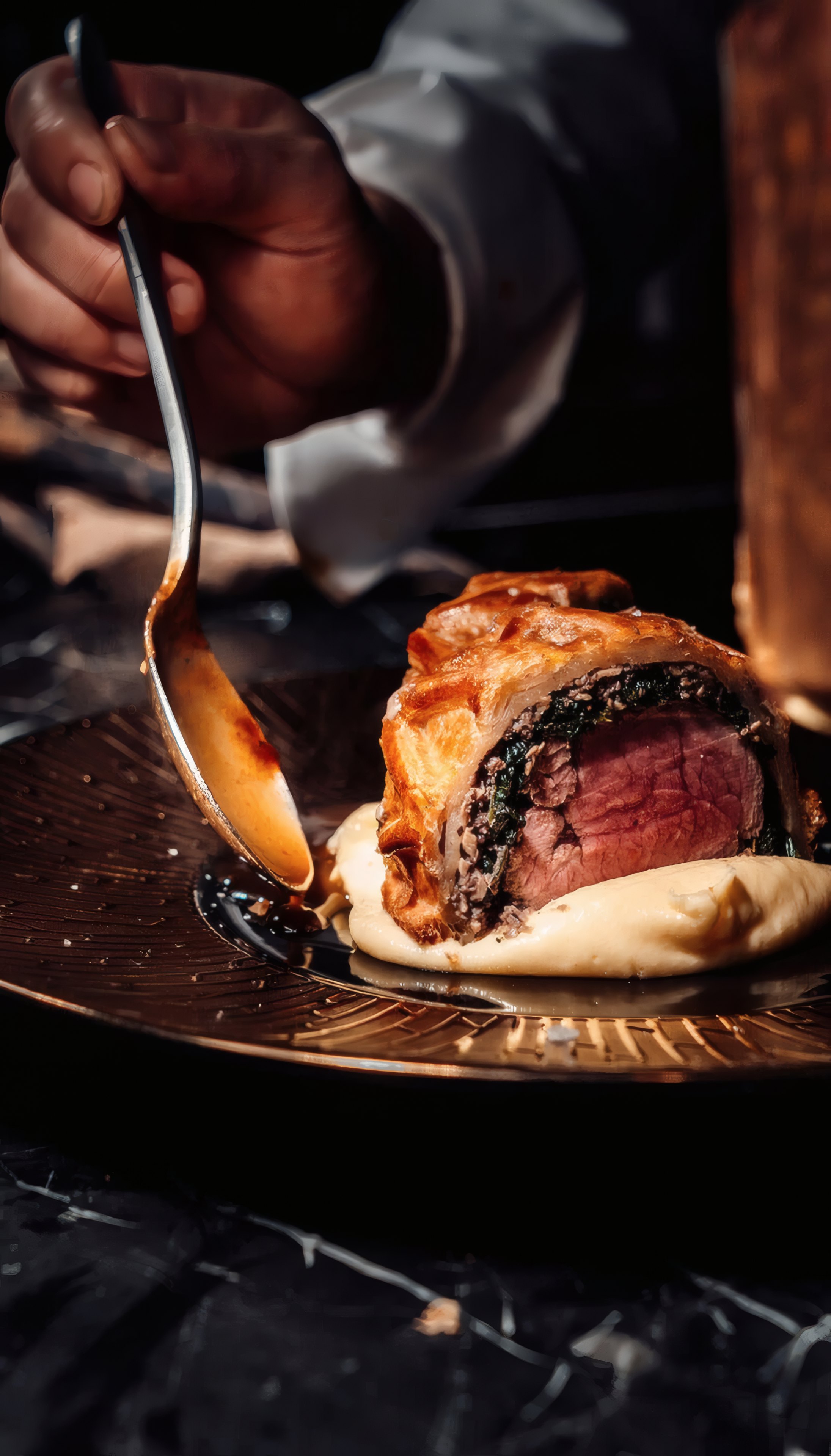 Sauce poured over a beef dish