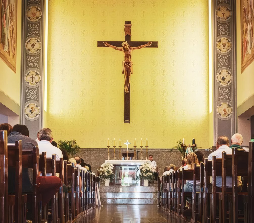 The congregation beneath the crucifix