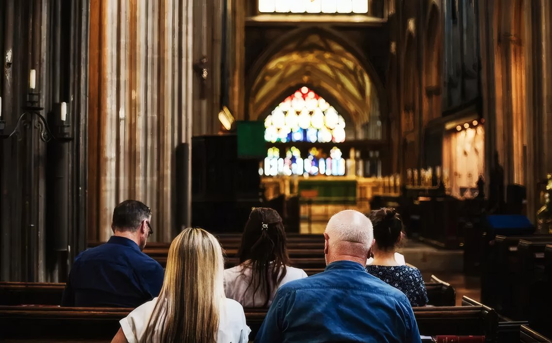A congregation in a candlelit church
