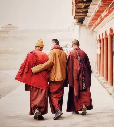 Three monks walking together