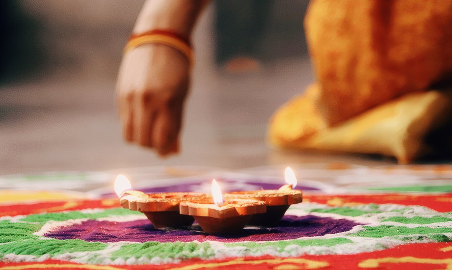 Deepavali lamps on a rangoli