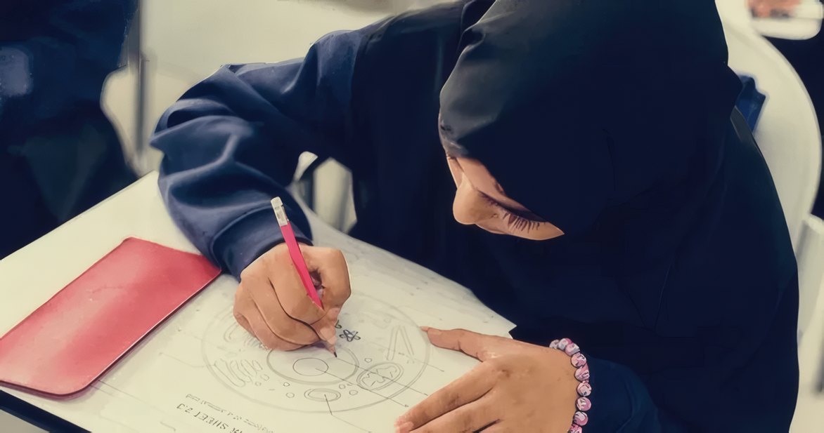 A girl drawing patterns at a desk