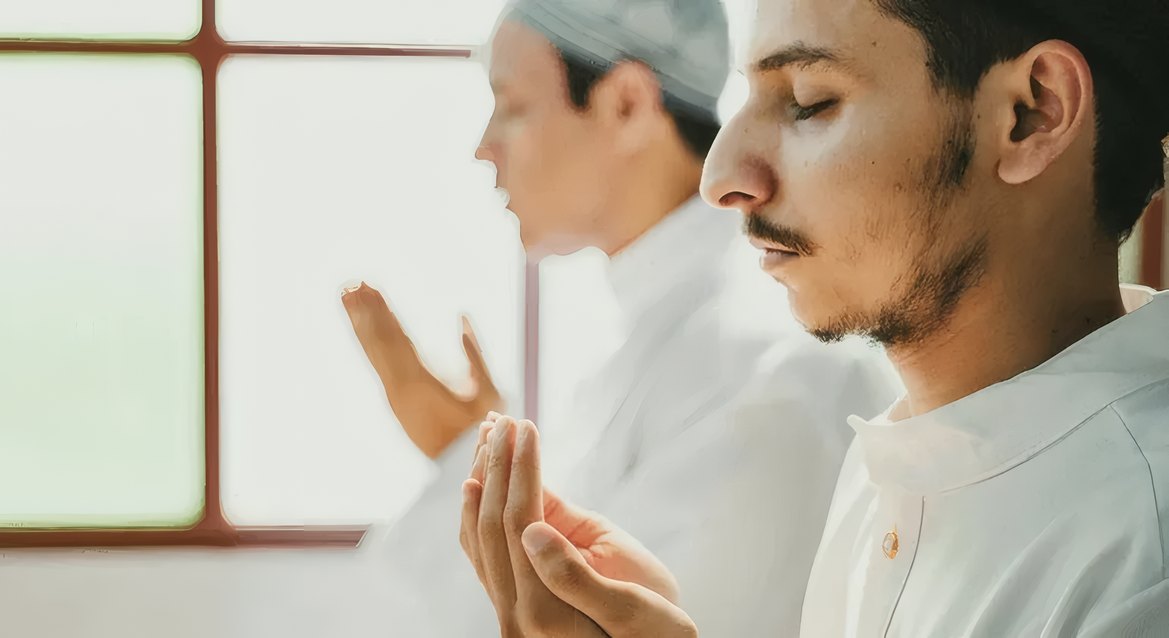 A young man making dua in the masjid