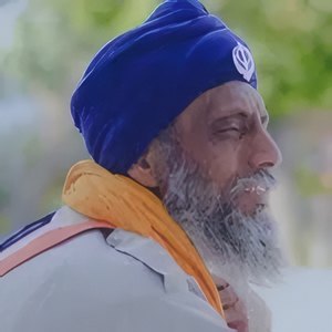 An elder in a blue turban