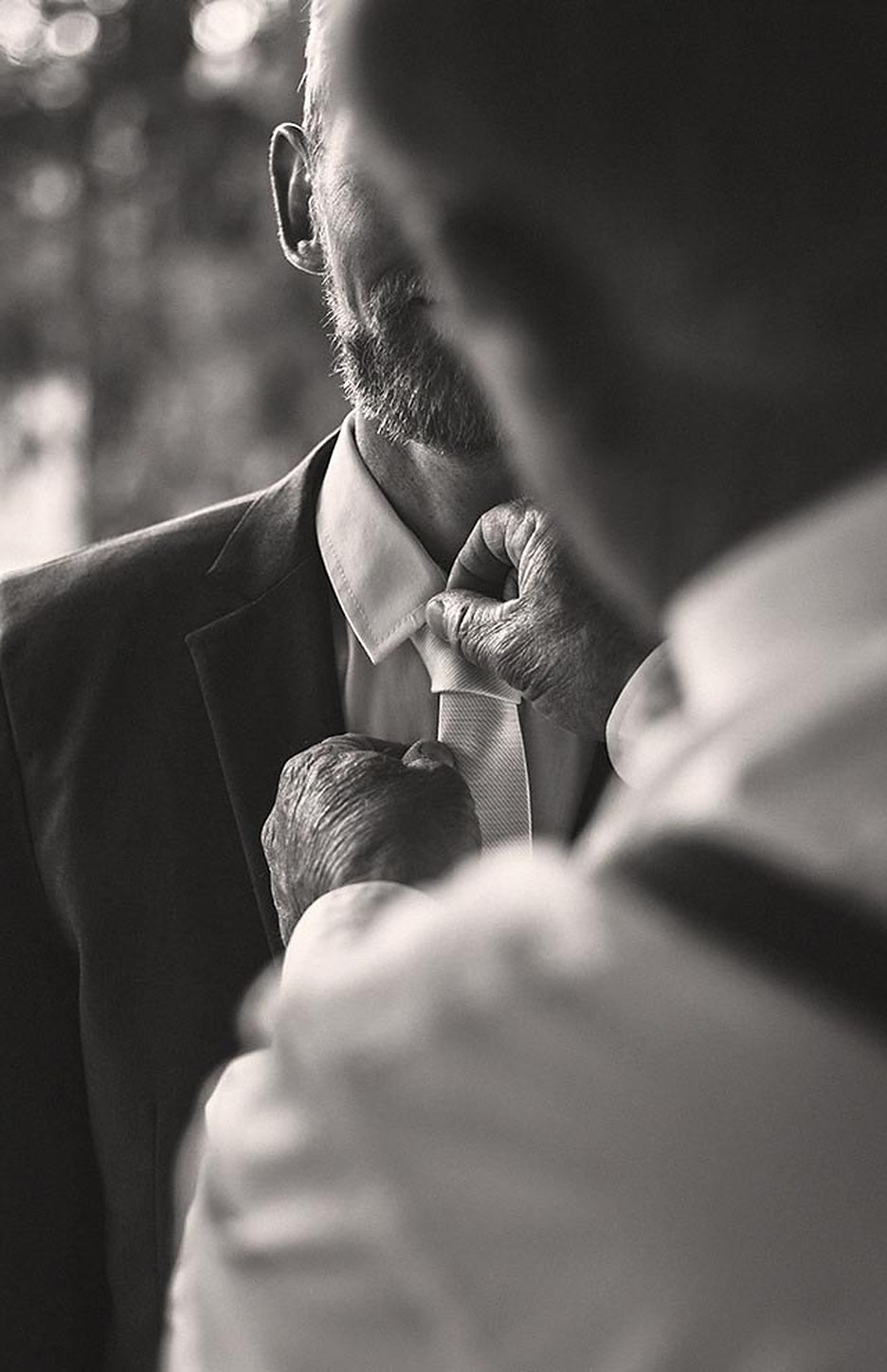 A cutter pinning a client's lapel