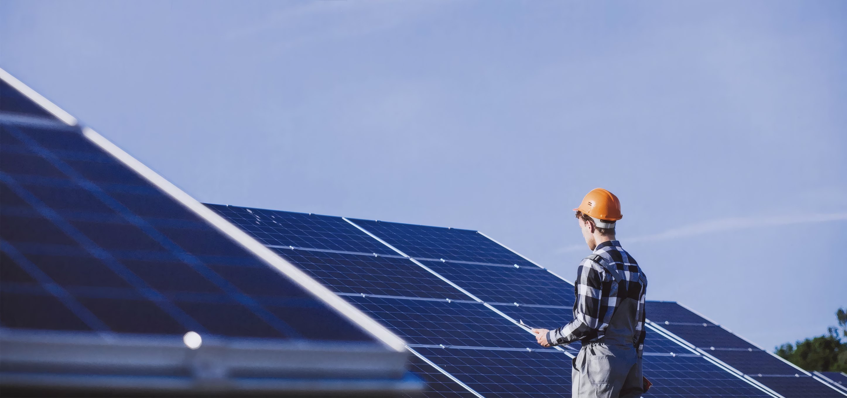 An installer checking a solar array