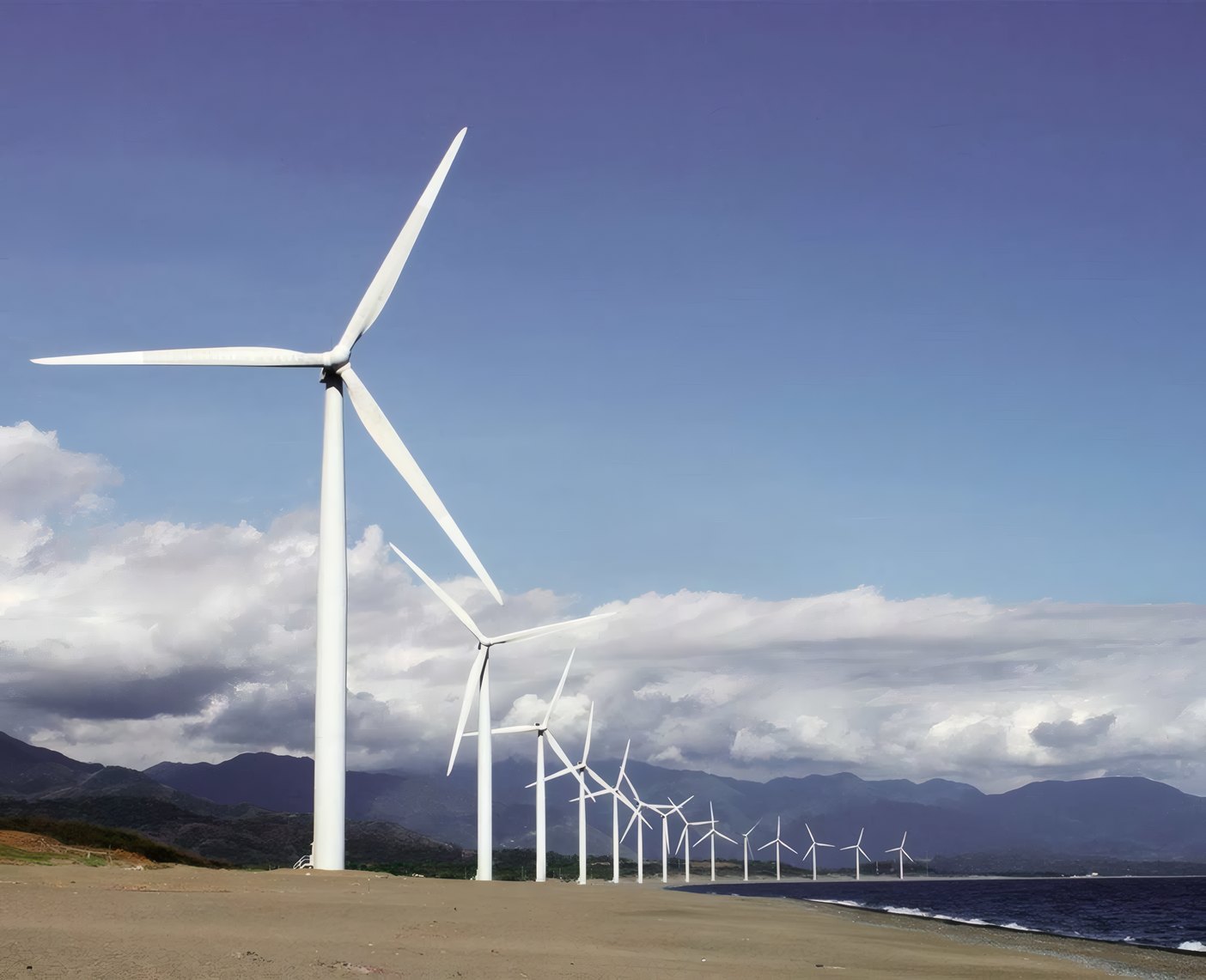 Turbines on a hill by the sea