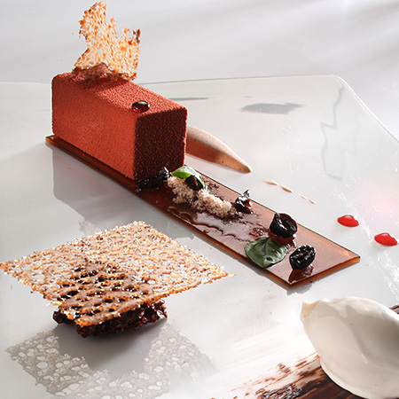 A chocolate dessert with a crisp lattice