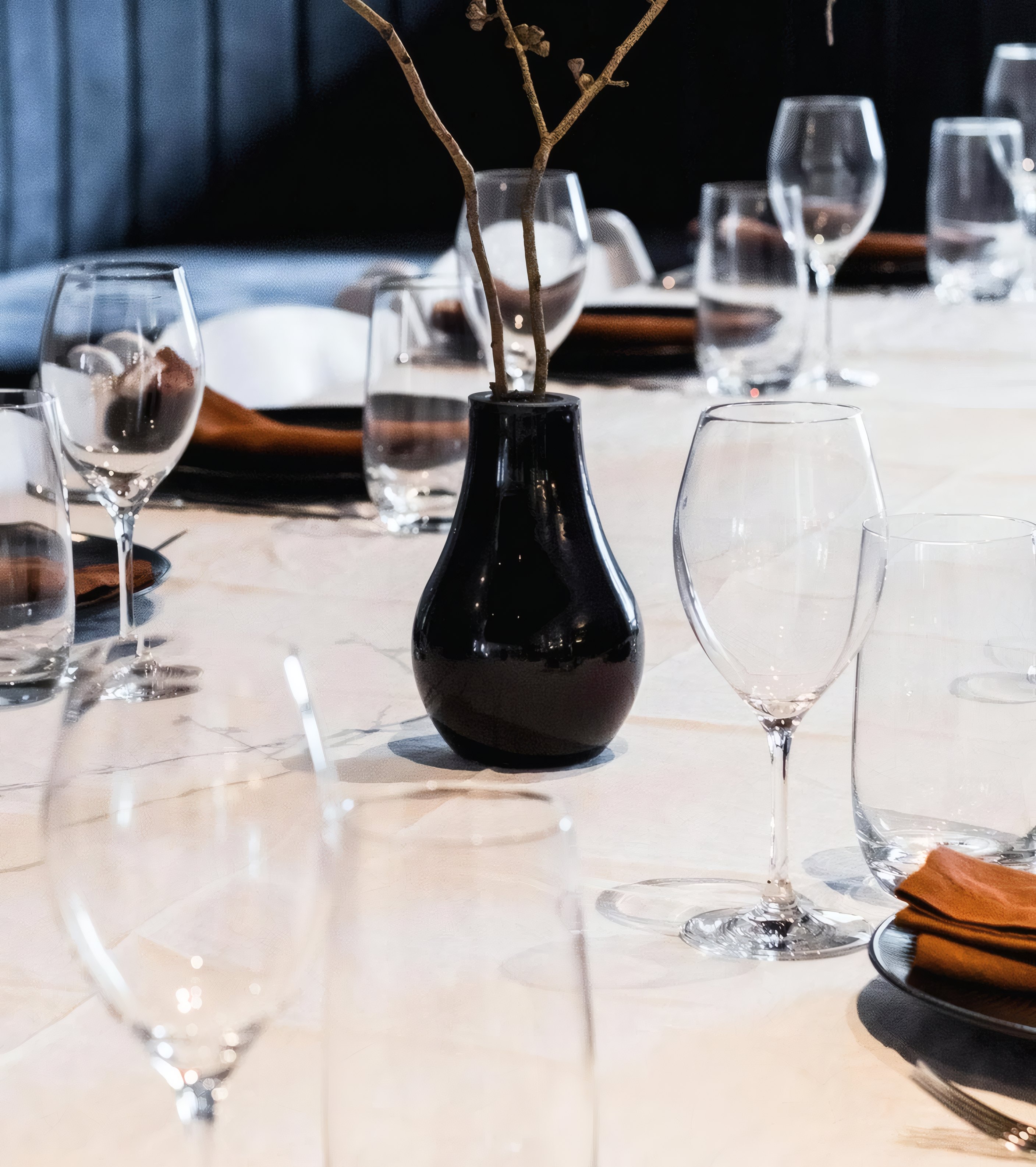 Wine glasses on a white tablecloth in the dining room