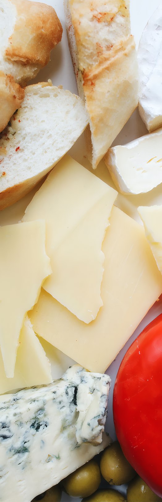 Hard and blue cheeses on a board