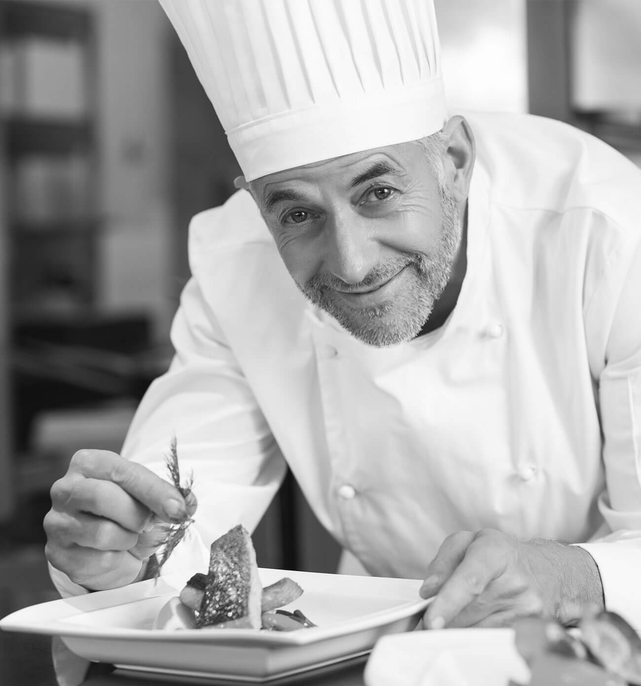 Chef Gabriel Laurent garnishing a plate