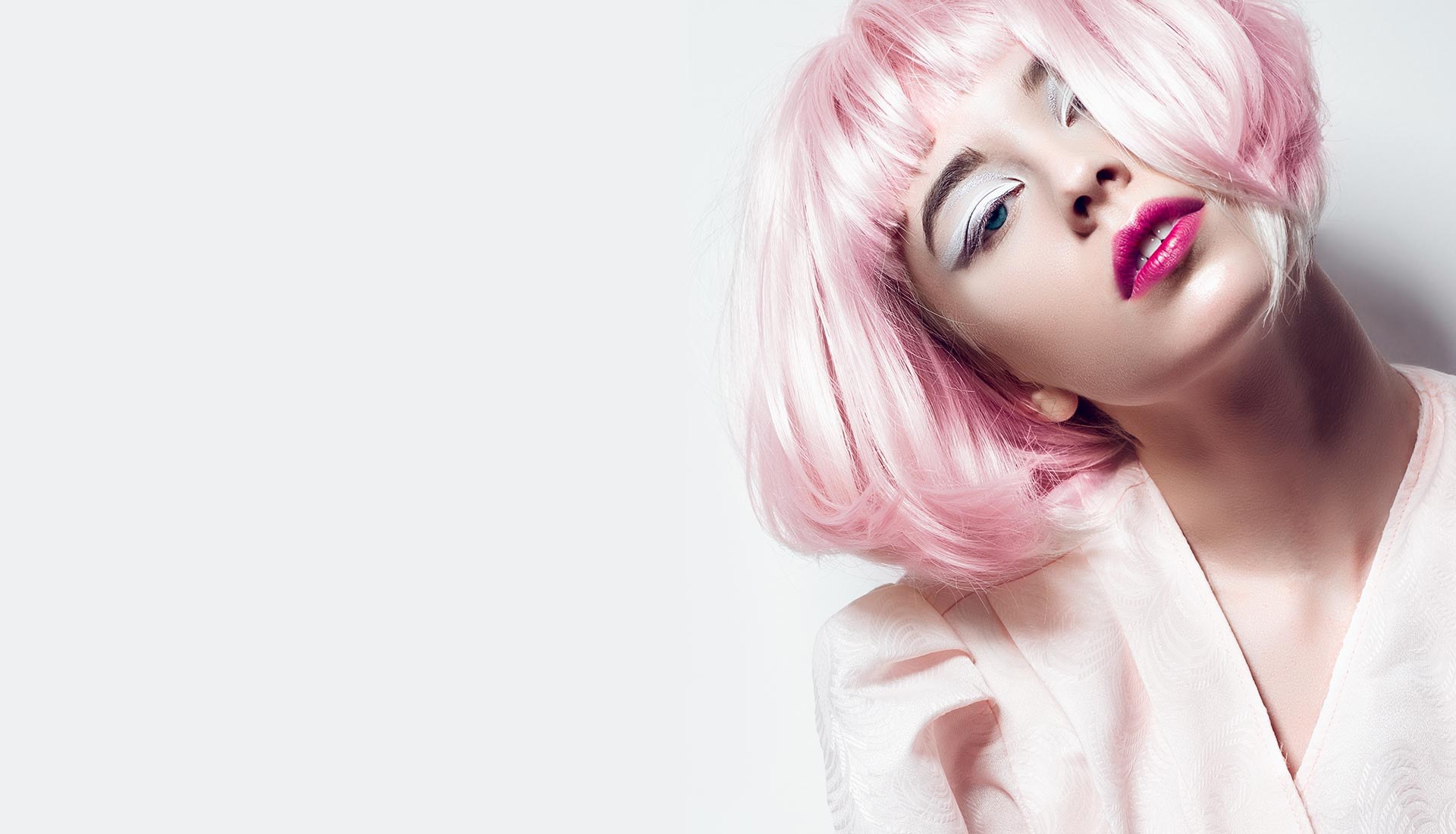 A model in a pink bob wig