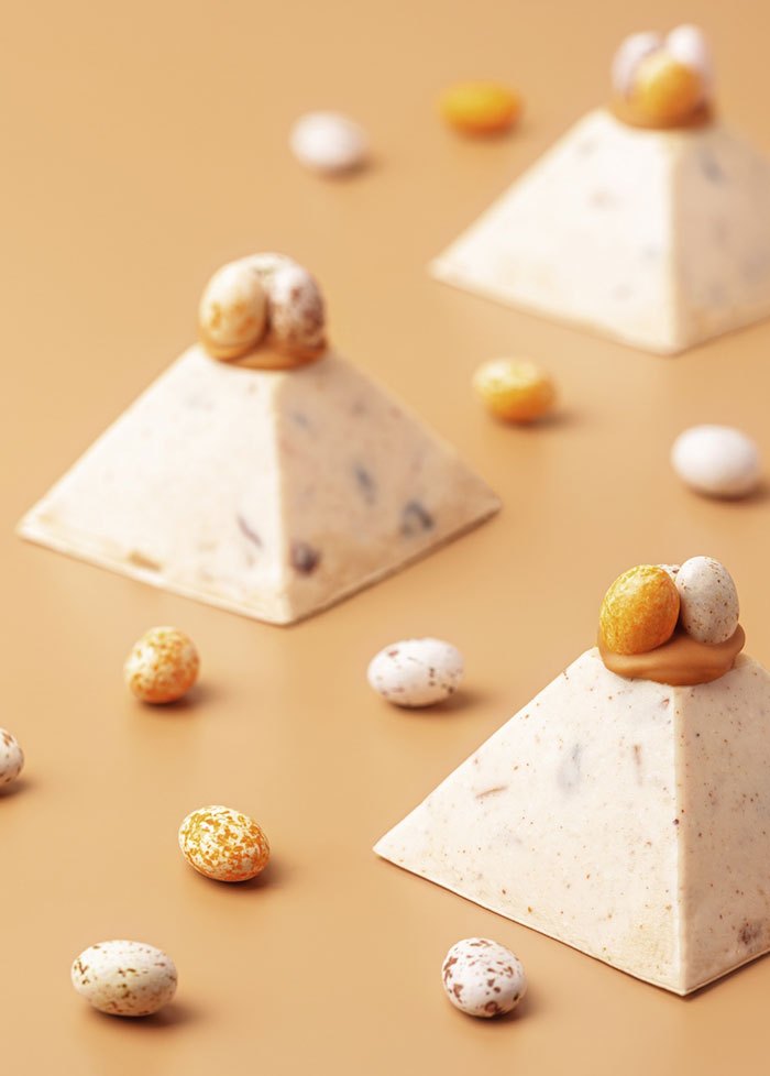White chocolate pyramids with candied almonds
