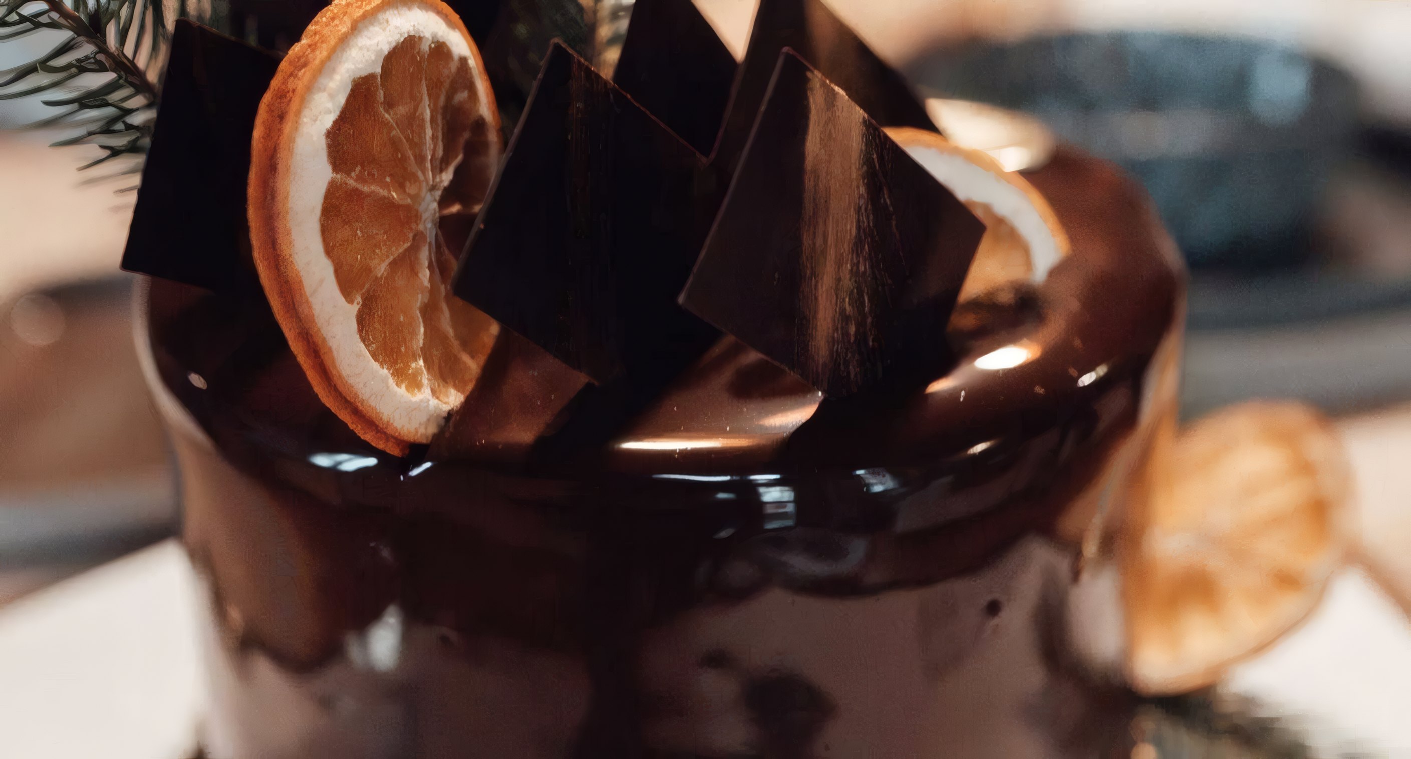 A chocolate cake crowned with orange and dark shards