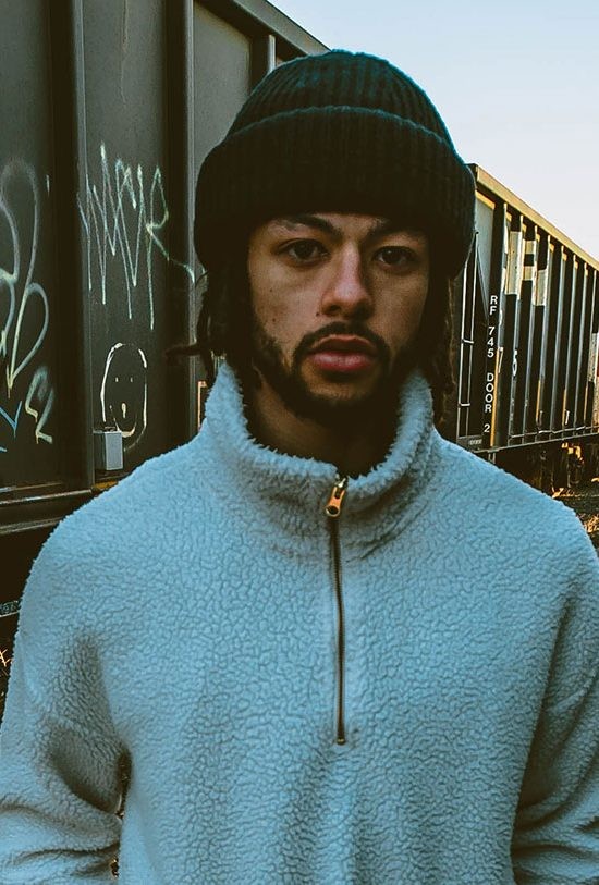 A rider from the skate team in a blue fleece