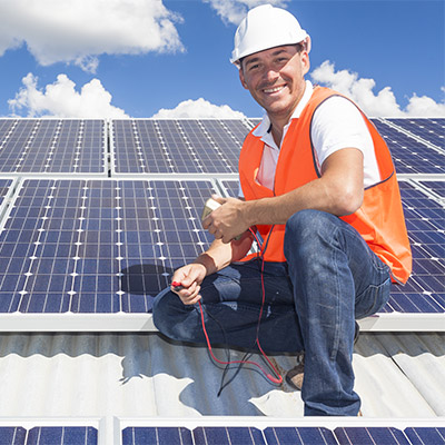 An engineer on a solar roof
