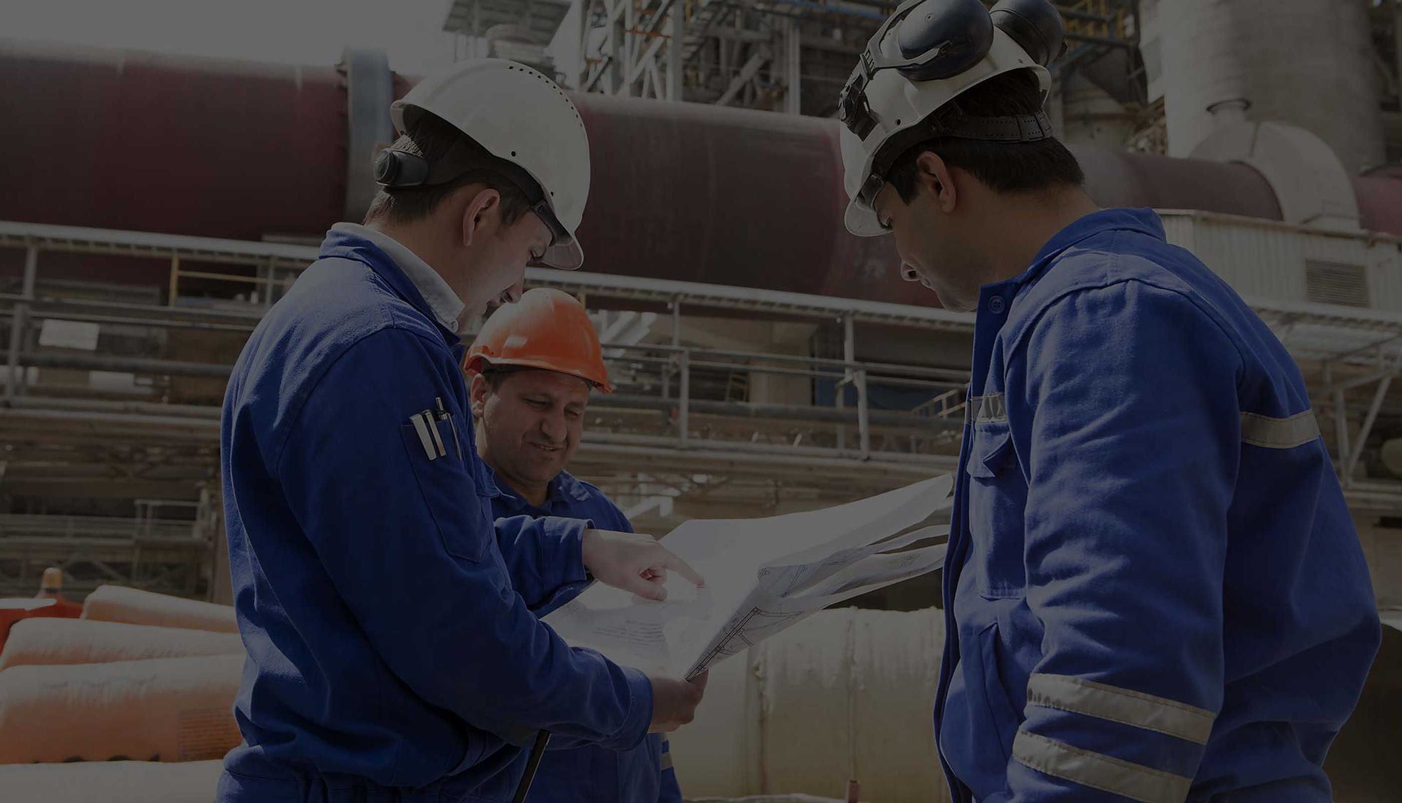 Engineers inspecting a production line