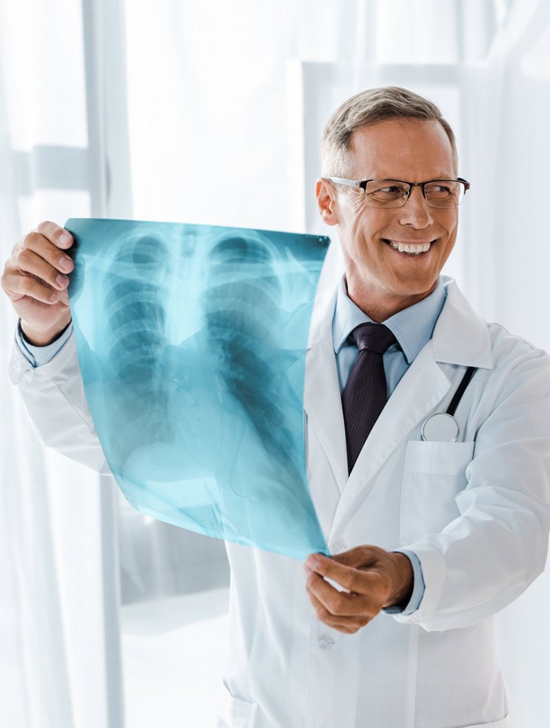 A doctor reading a chest X-ray