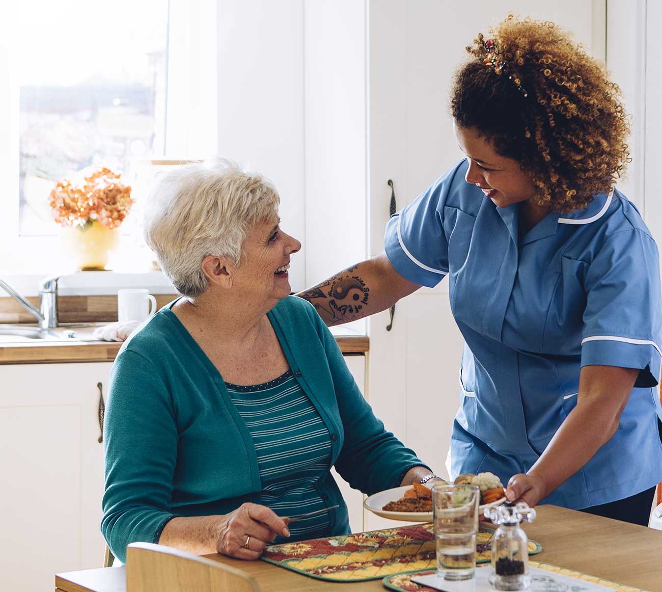 A nurse visiting an older patient at home