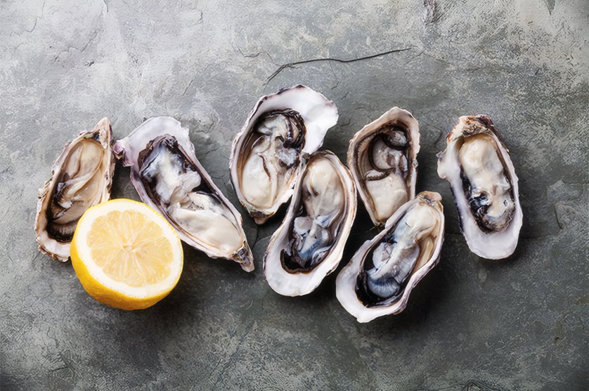 Oysters with lemon on a slate