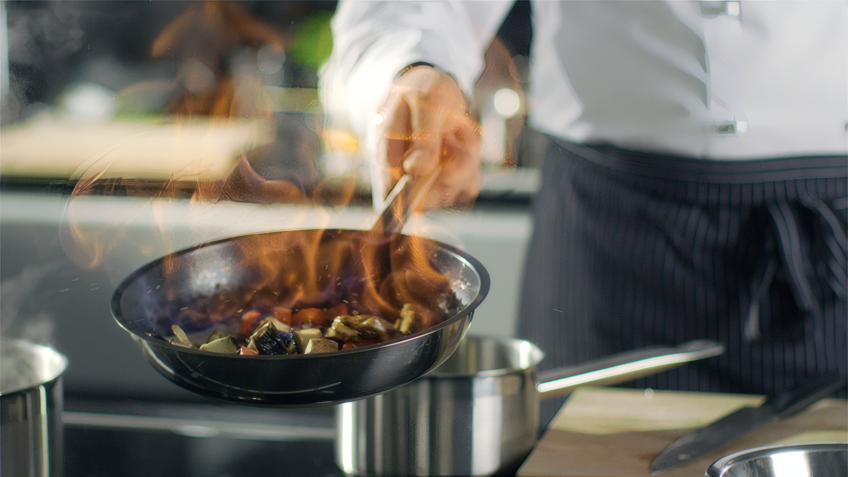 Flames rising from a pan on the stove