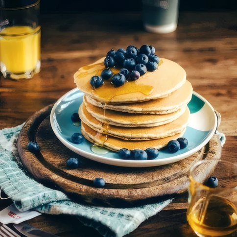 A stack of pancakes with blueberries