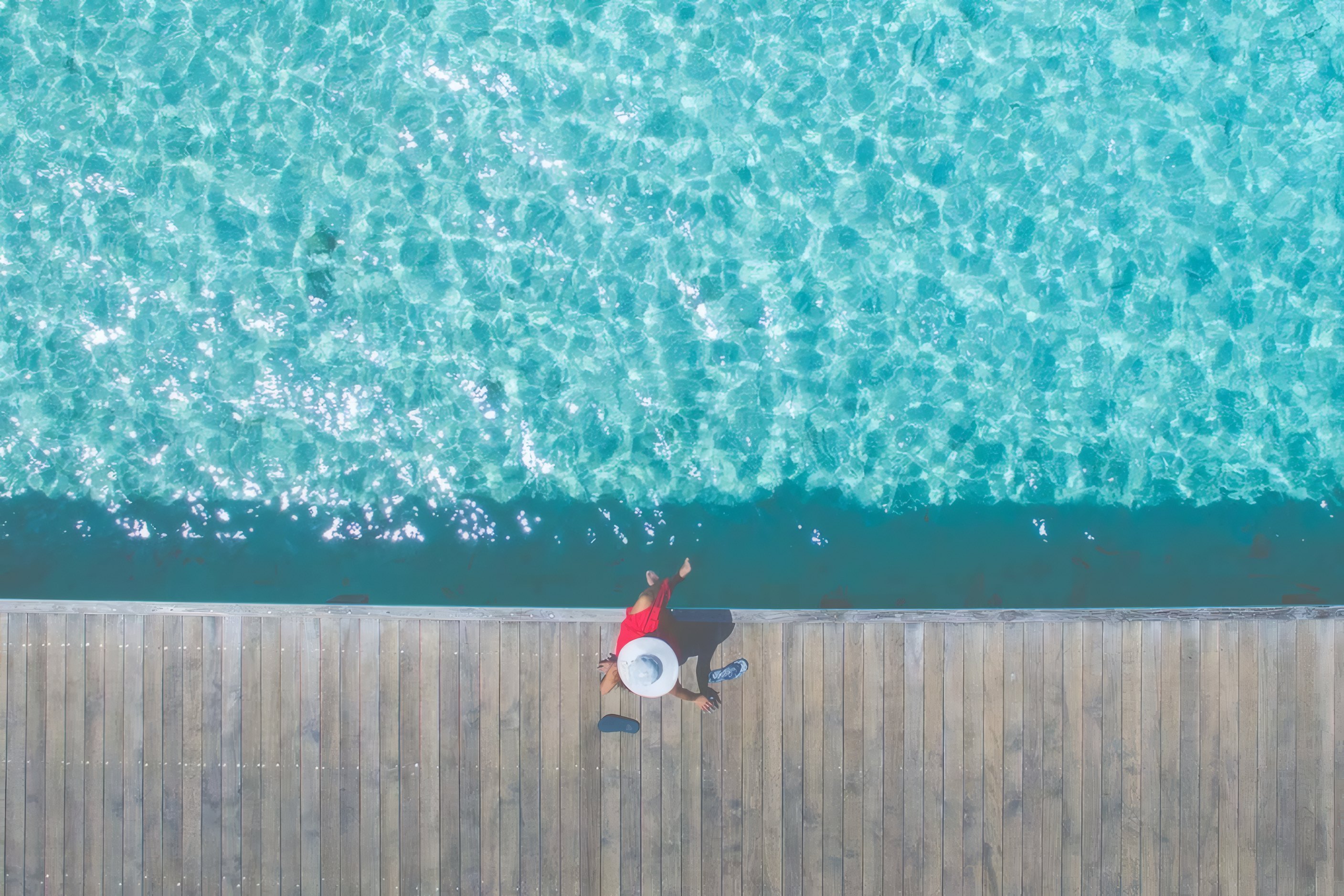 Lido Terraces from above, a turquoise pool beside a timber deck
