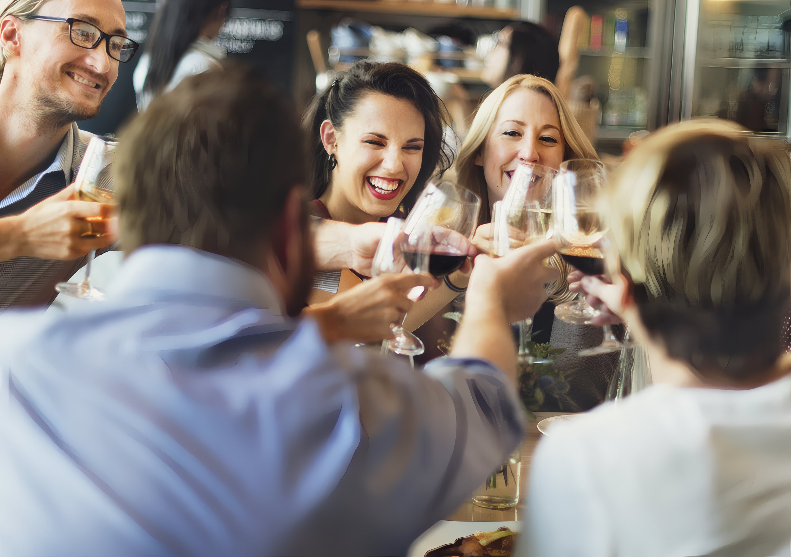Colleagues raising glasses at a dinner