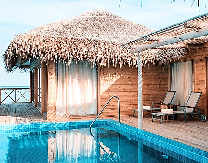 The palm cabana beside its plunge pool