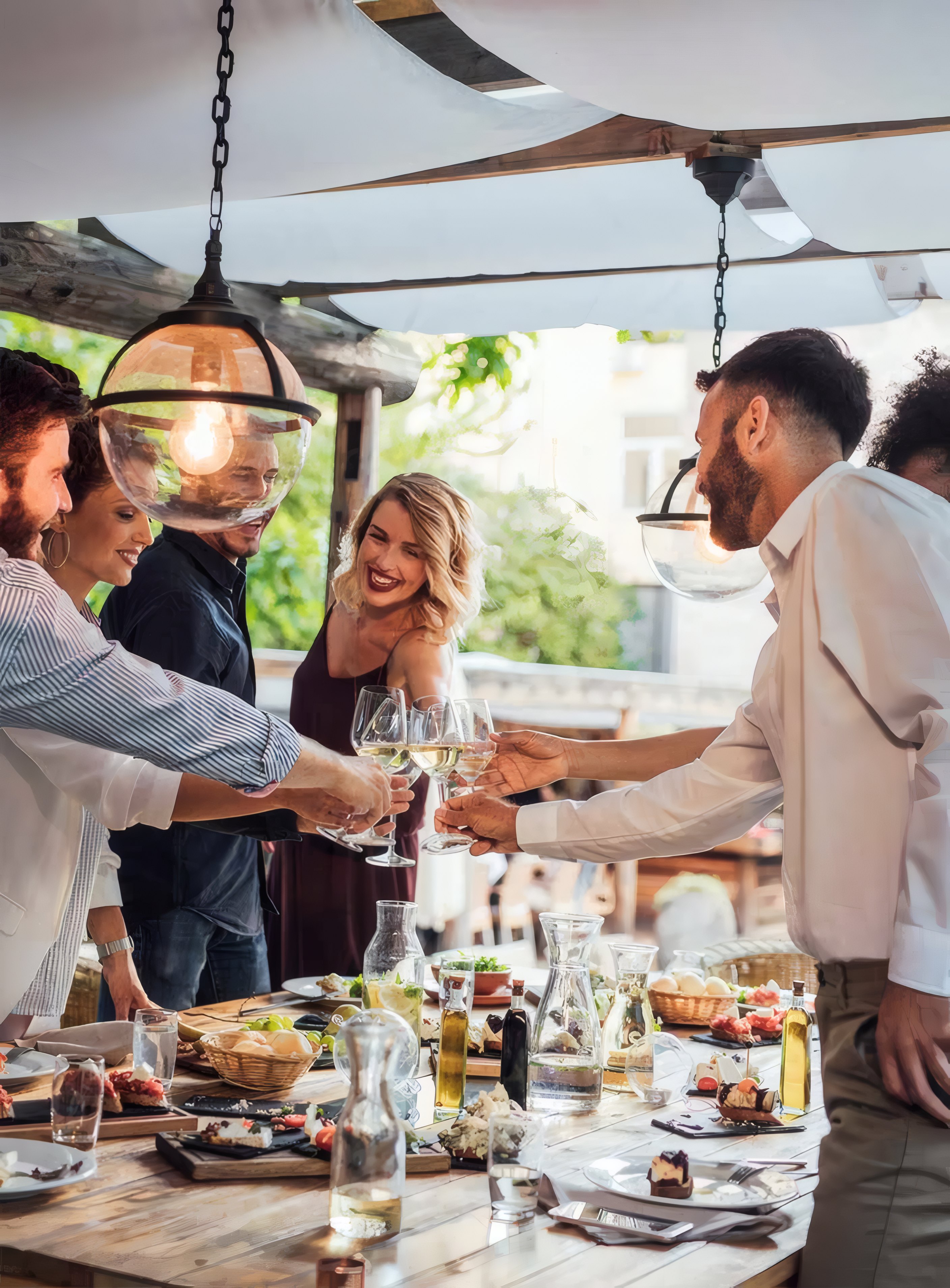 Guests at a long table under the pergola