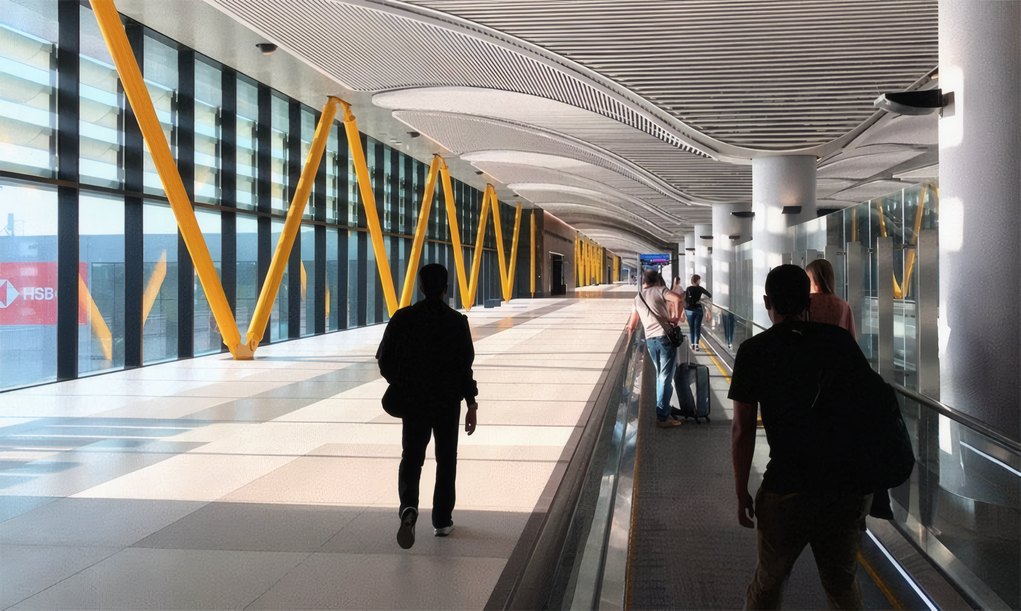 Travellers in a terminal walkway