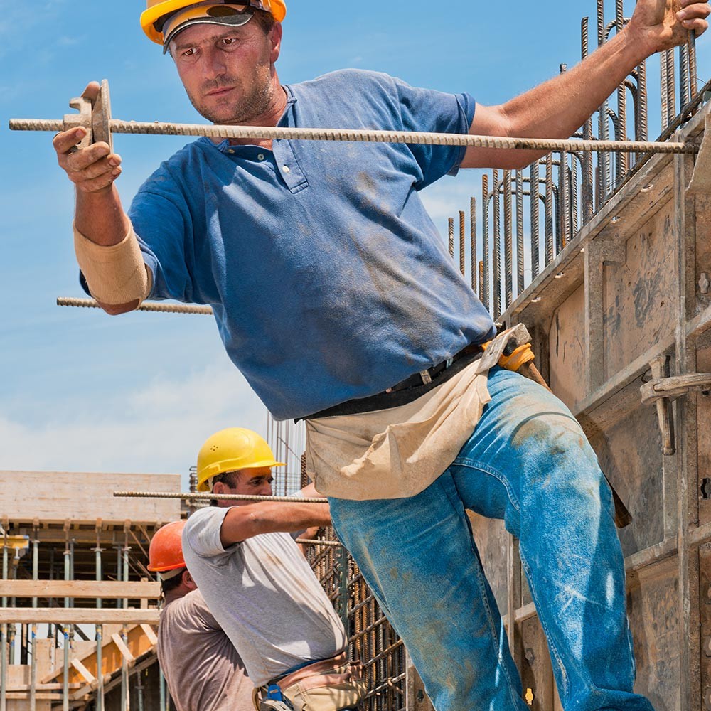 A steel fixer on a rebar cage
