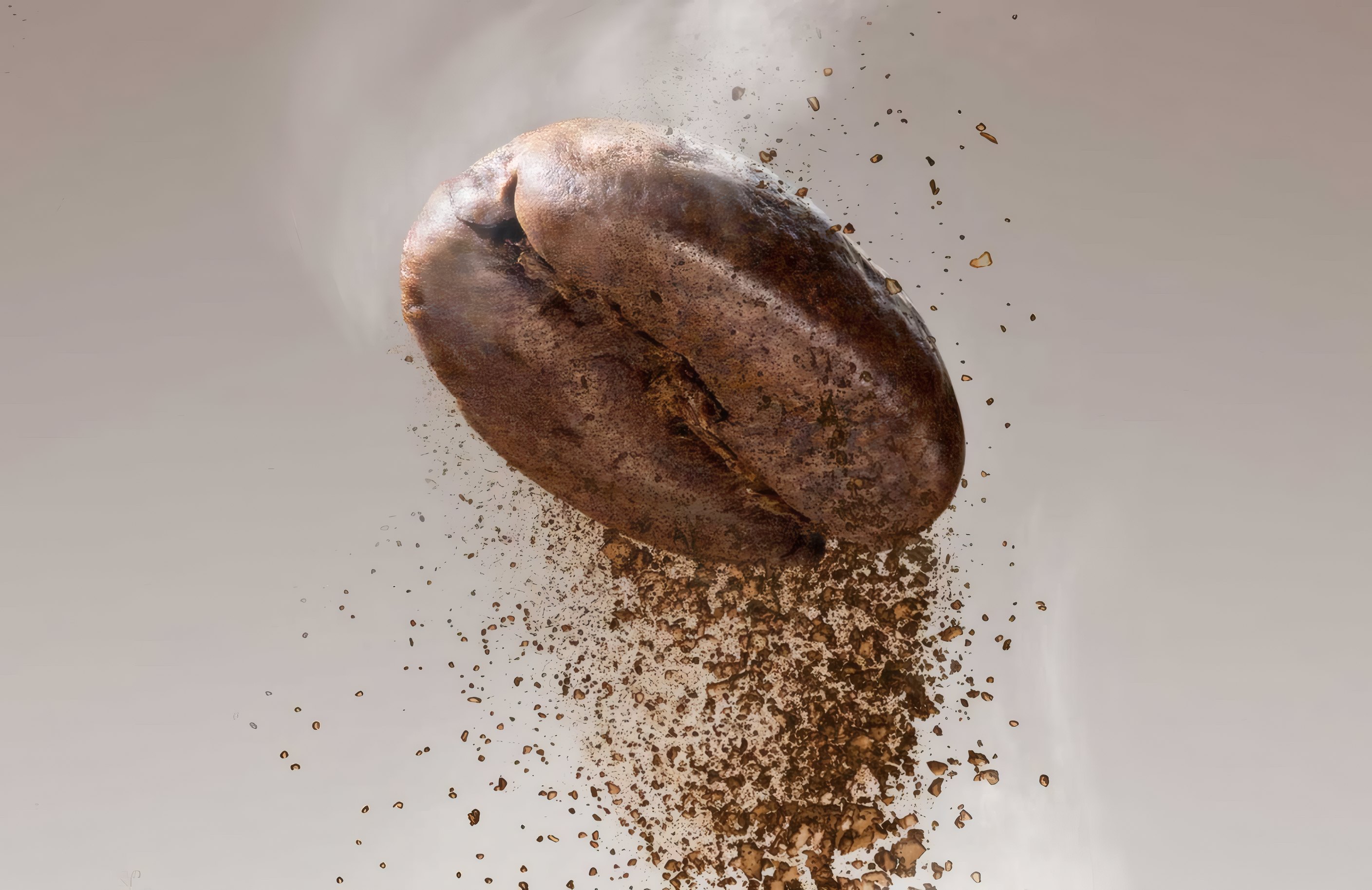 A single roasted coffee bean breaking into grounds in mid-air