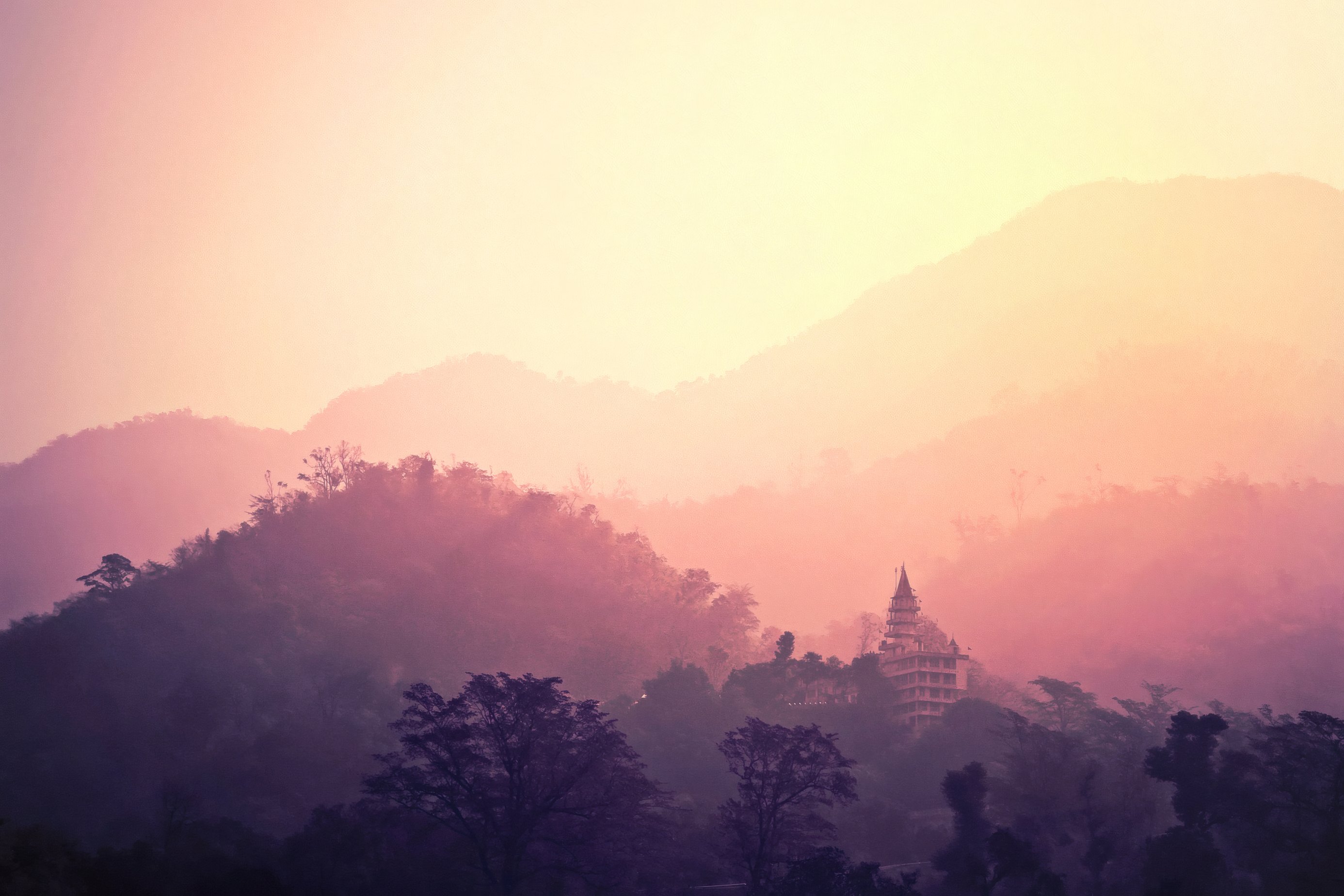 The temple at dawn above the hills