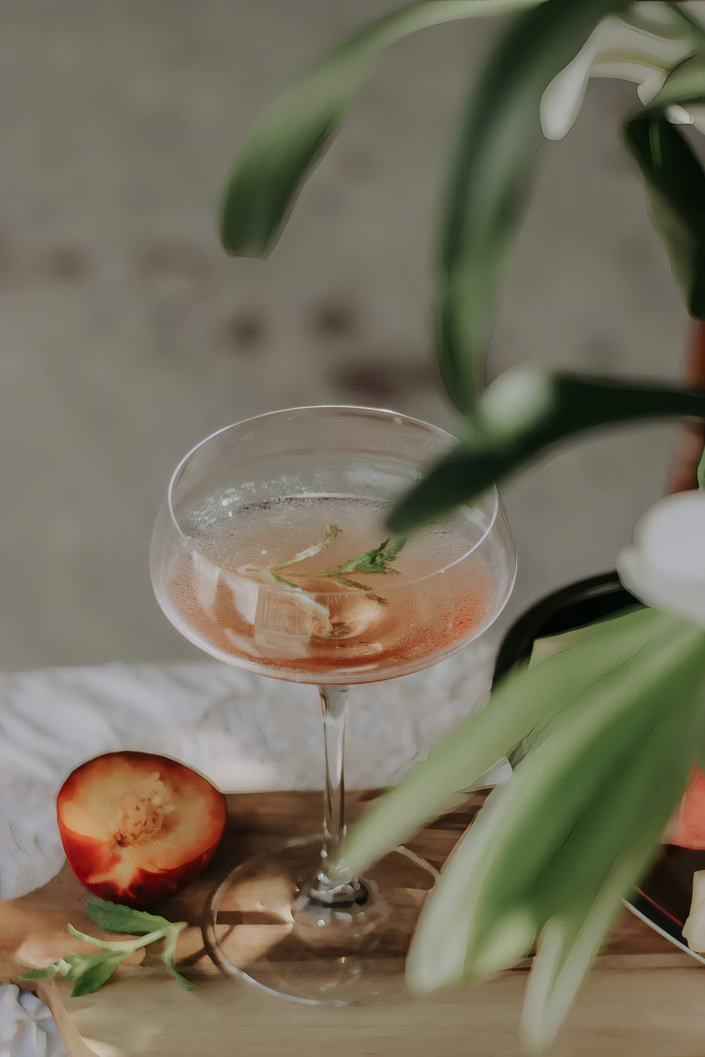 A glass of champagne among flowers