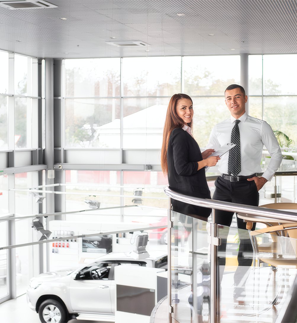 An inspector checking a car on a lift