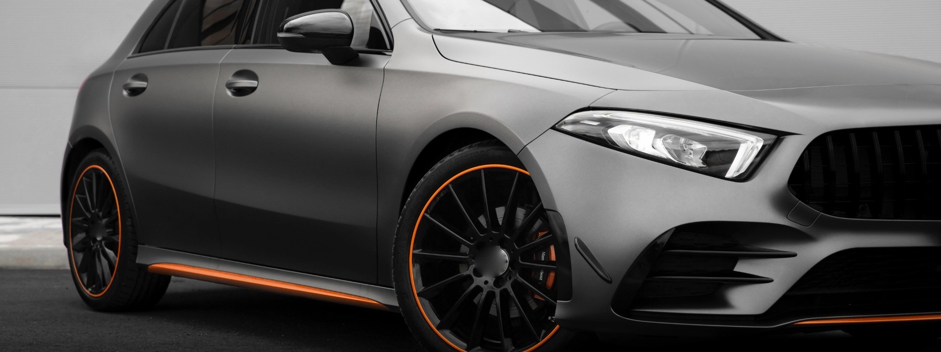 A matte graphite hatch with orange stripes
