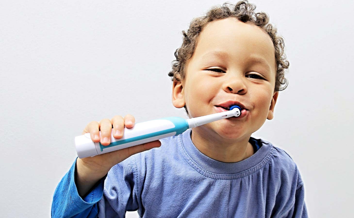 A boy brushing his teeth