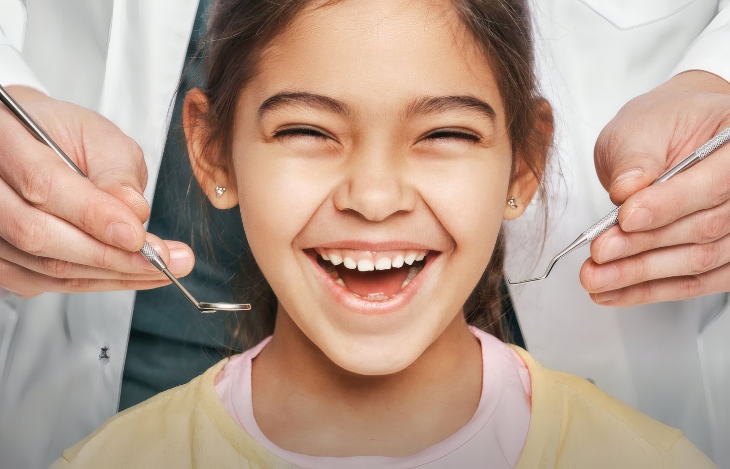 A laughing girl at her dental checkup