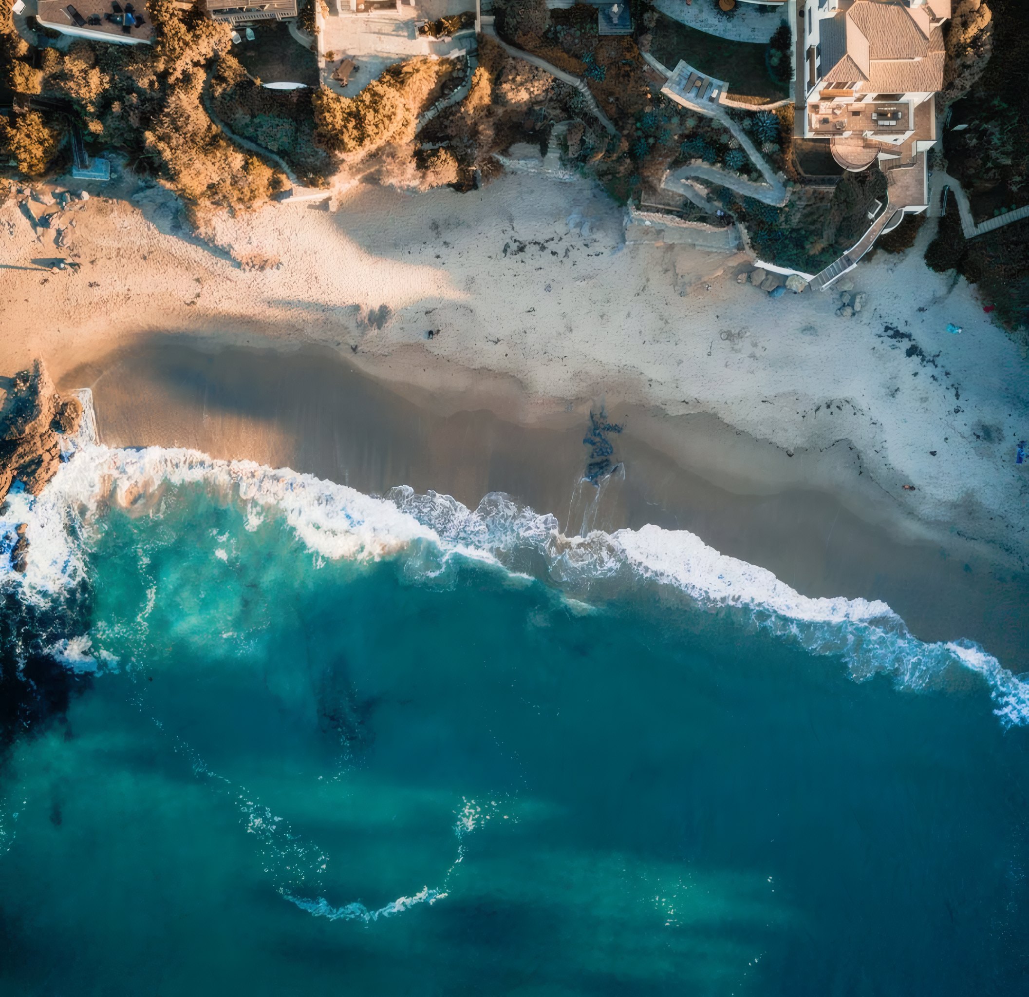 A sandy cove seen from above