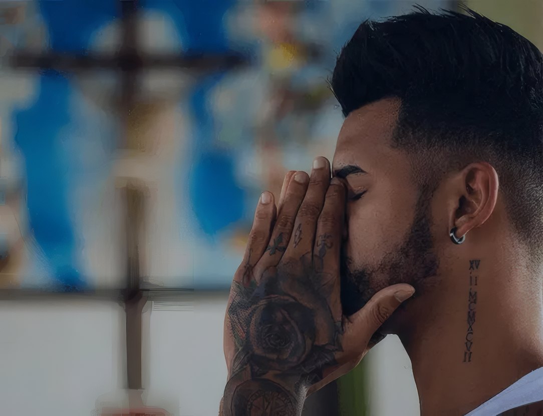 A worshipper in prayer during the live broadcast