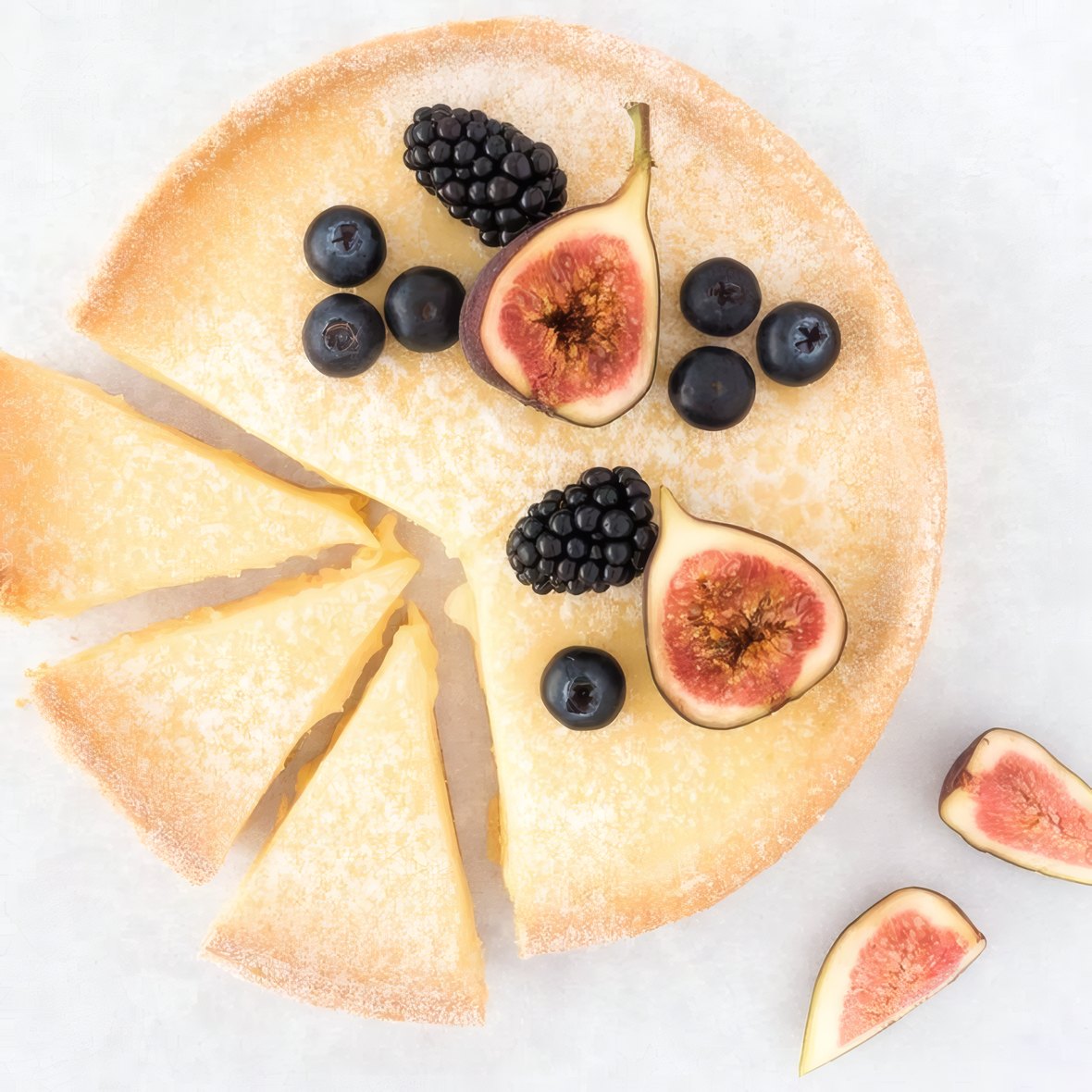 A berry and fig custard tart seen from above
