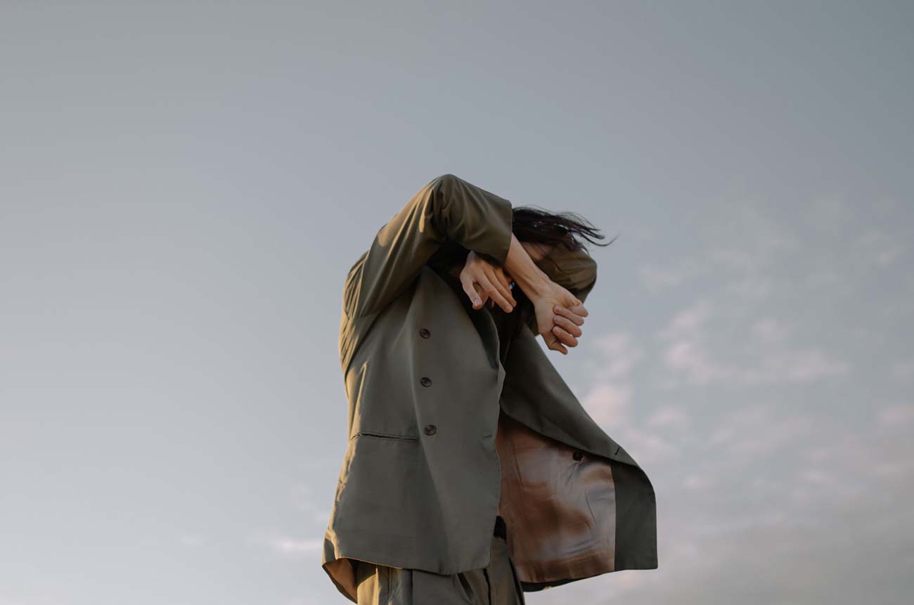 A frame from Salt Road: a coat flying in the wind