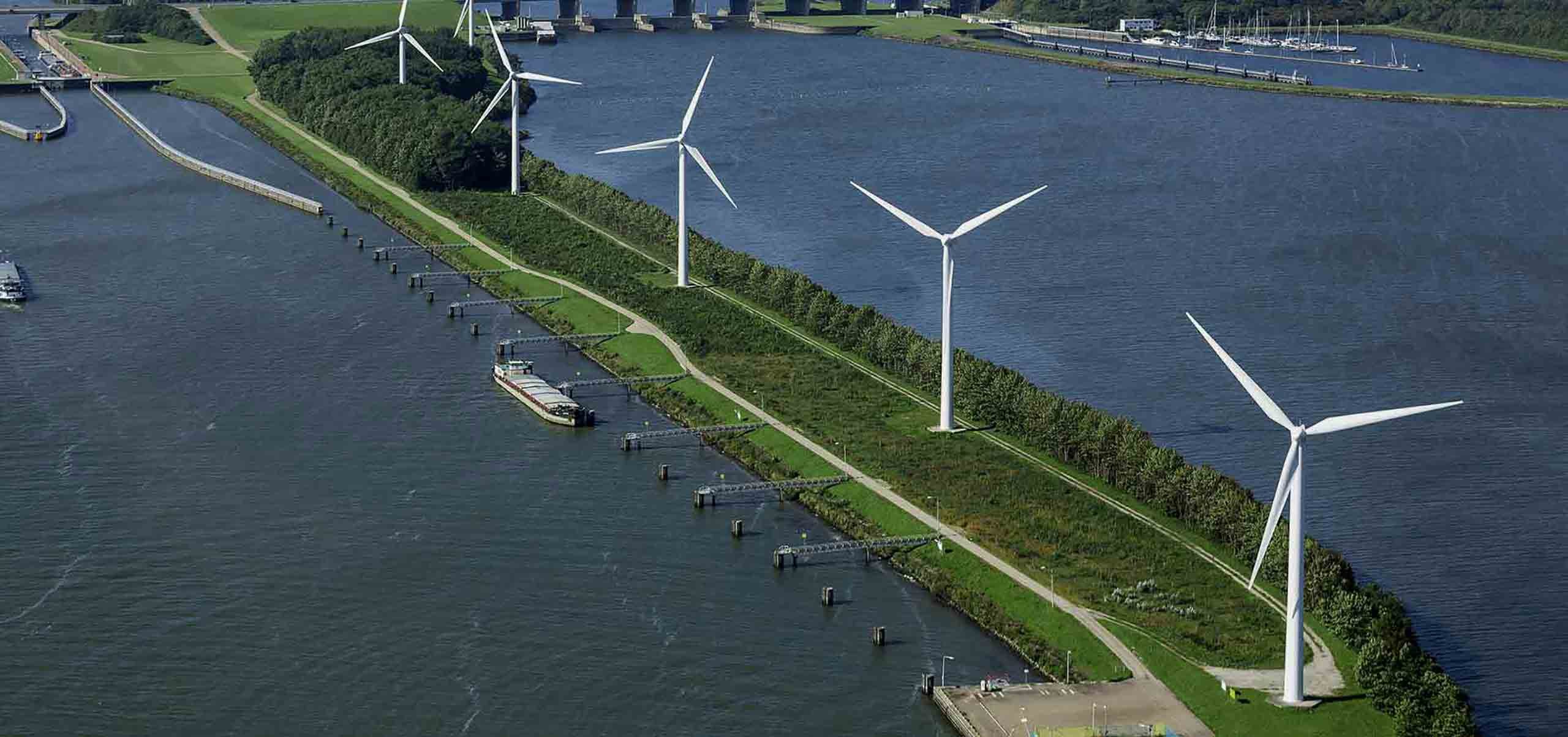 Turbines along a canal dyke, from the air