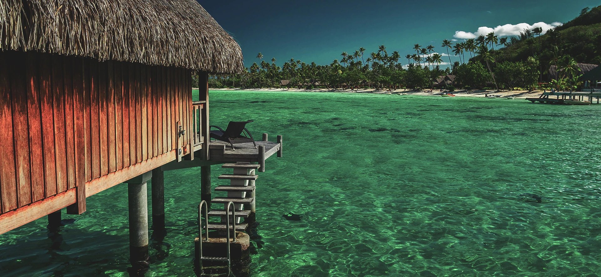 Lake cabins standing over clear water
