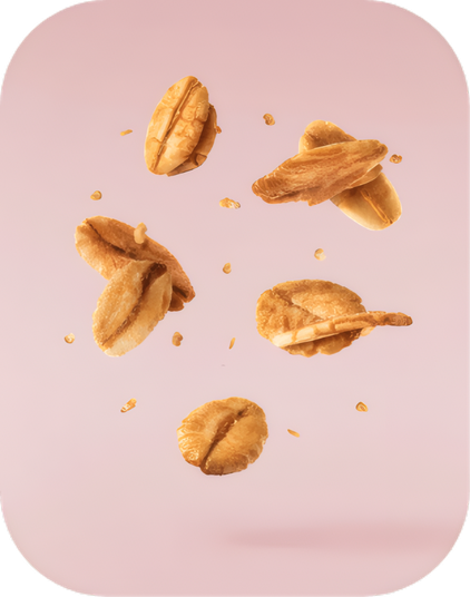 Walnut halves falling on a pink ground