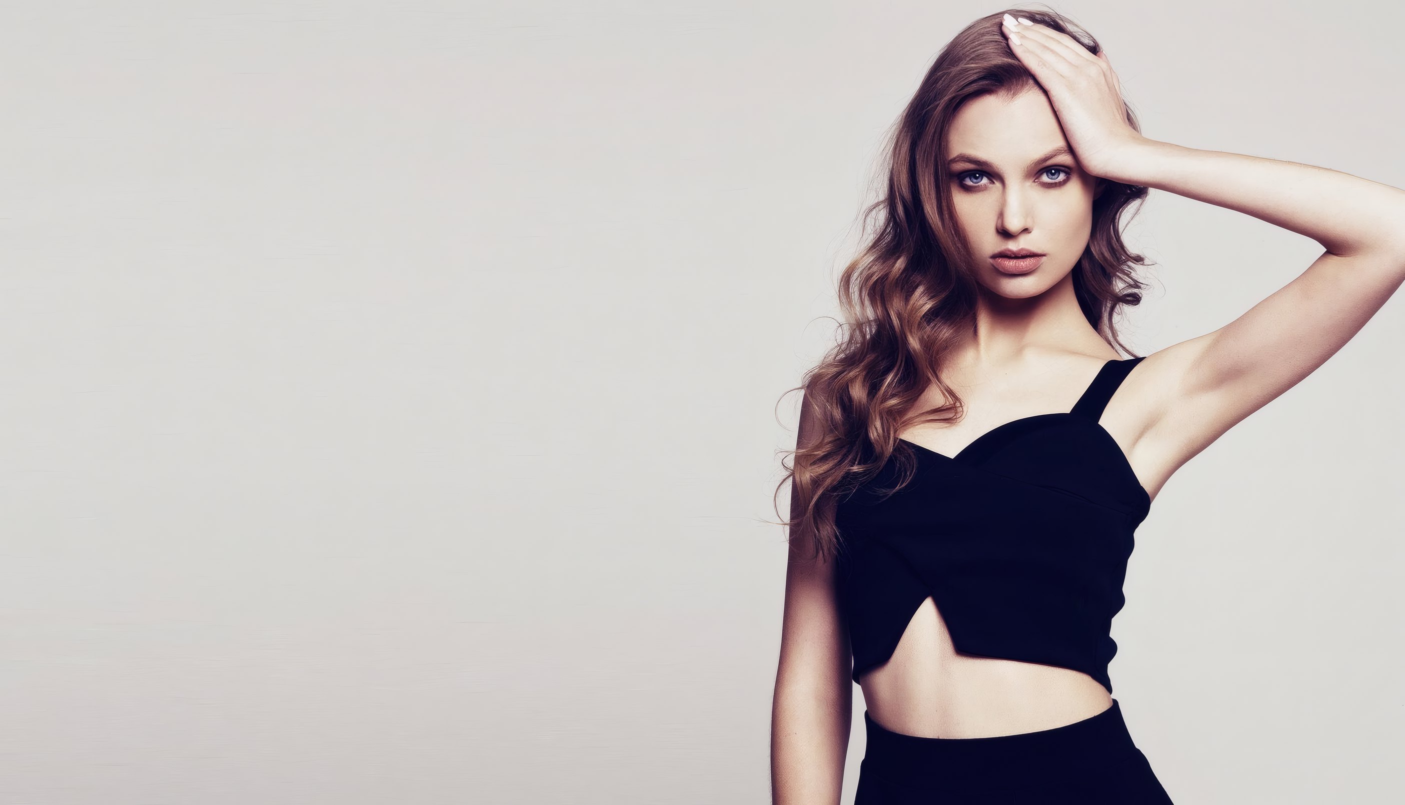 A model in a black bandeau in the studio