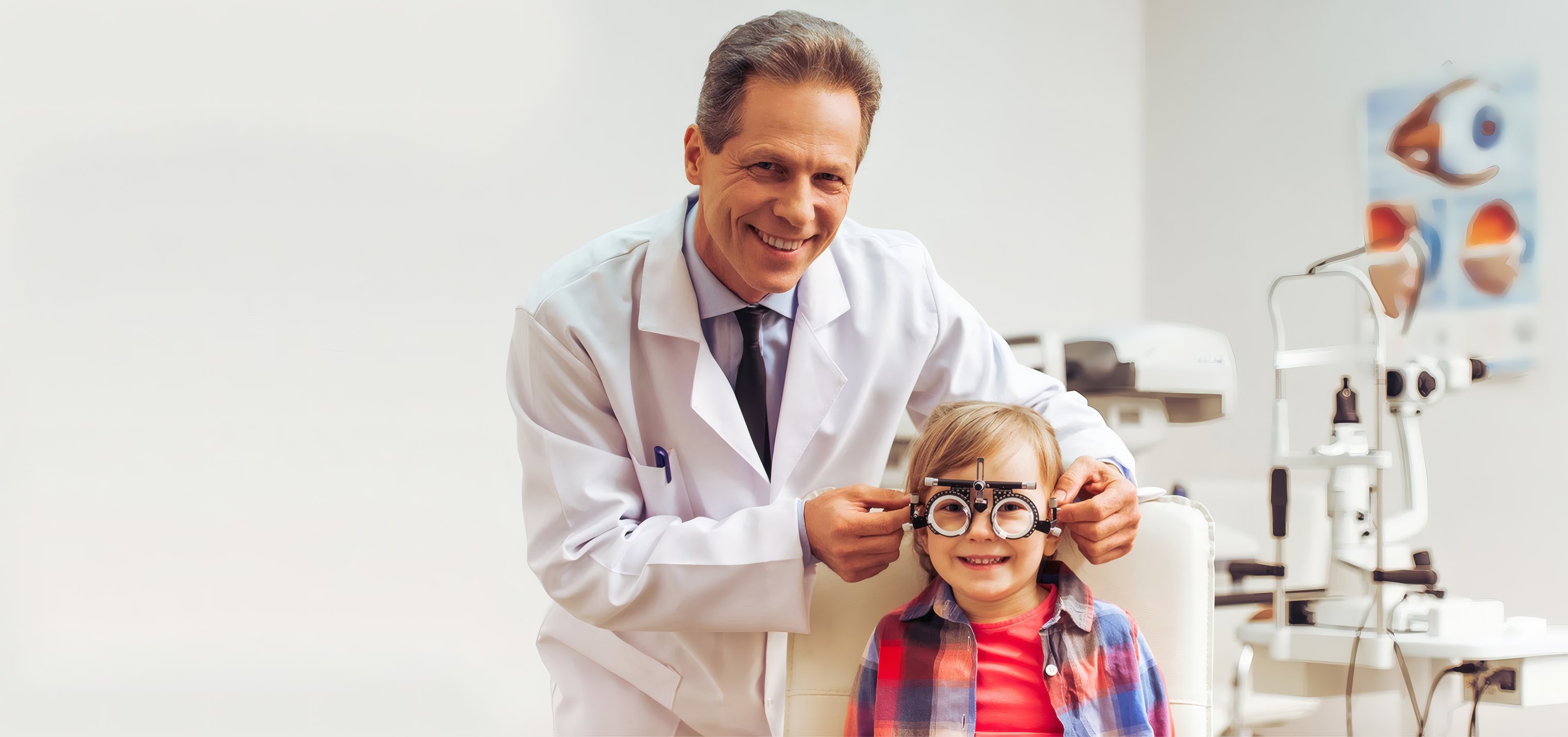 An optometrist fitting a girl's new glasses