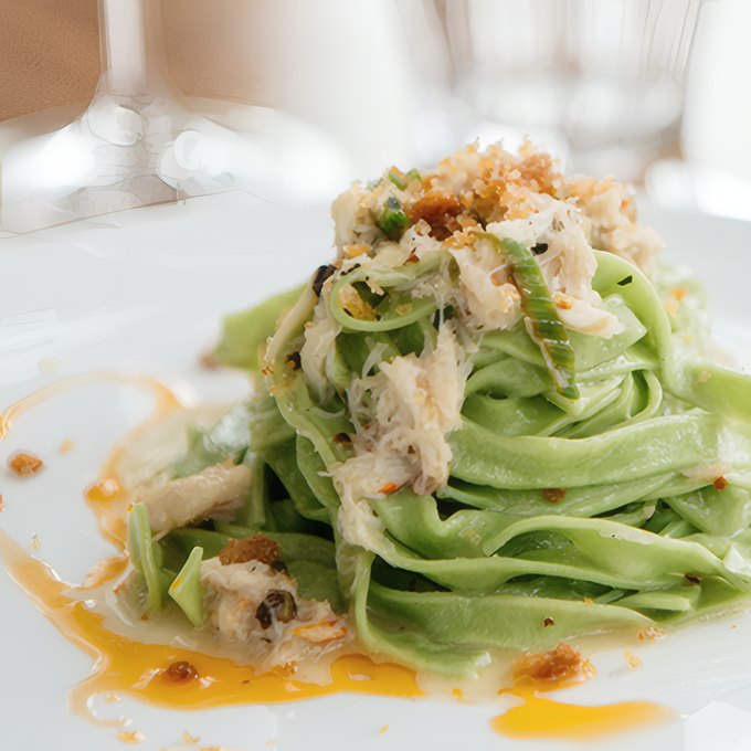 Green tagliatelle with crab and herbs